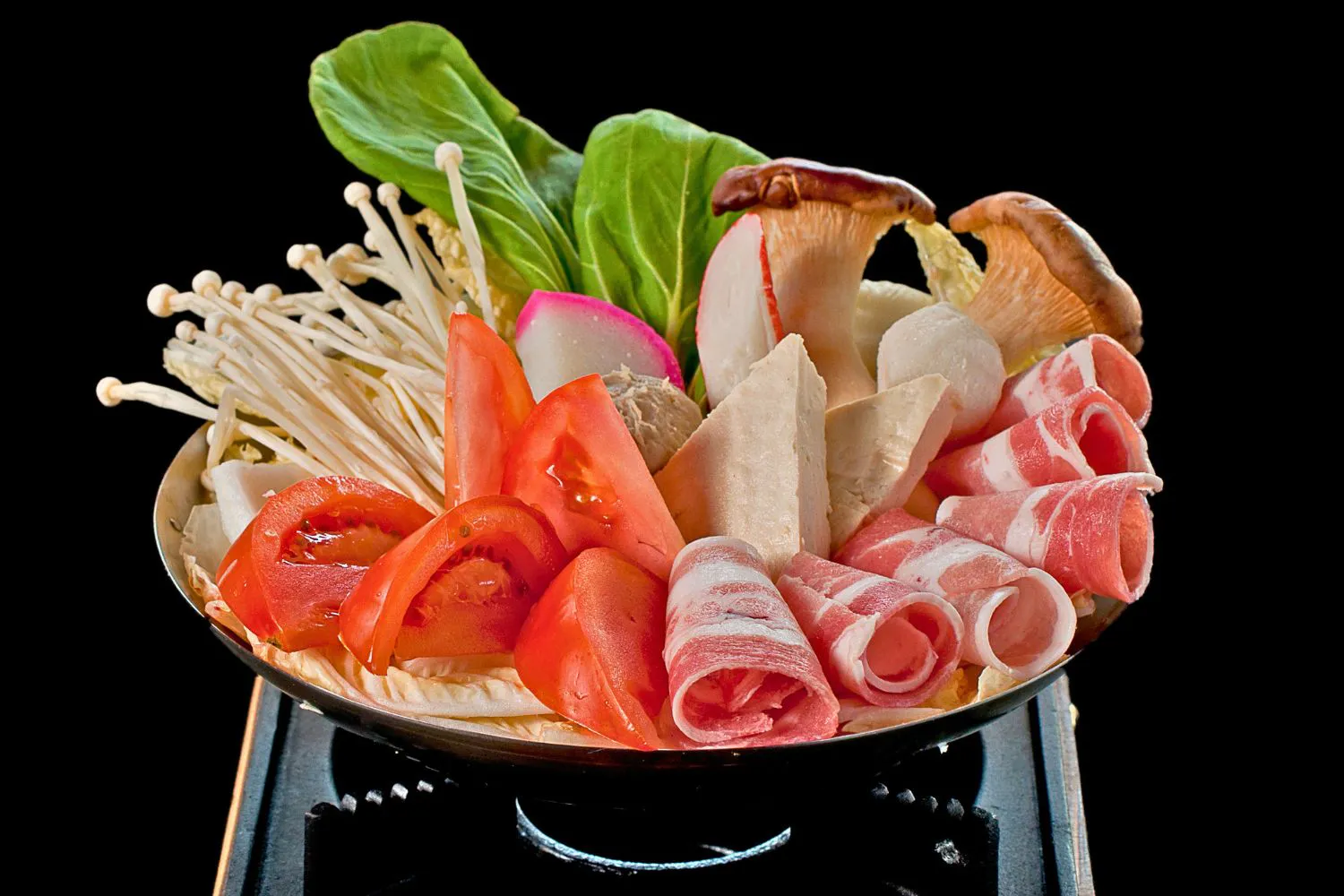Hot pot raw platter with beef rolls, tomatoes, enoki mushrooms and assorted veggies at Feast Utopia Clackamas, an Asian Fusion Restaurant in Clackamas
