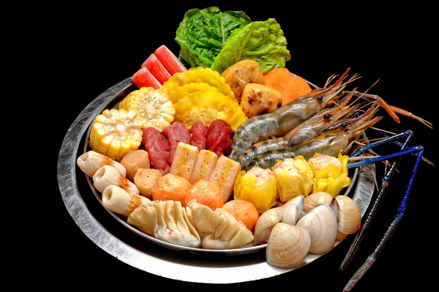 Seafood hot pot platter with prawns, clams, dumplings, corn and assorted meat balls at Feast Utopia Clackamas, an Asian Fusion Restaurant in Clackamas
